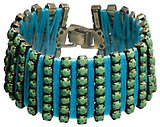 image for bracelet Africanica green antique silver (7 rows PP 31: op. green stones bended with blue thread)